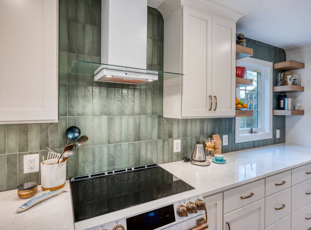 Inspiration for a large transitional kitchen remodel in DC Metro with flat-panel cabinets, white cabinets, quartz countertops, green backsplash, ceramic backsplash, an island and white countertops