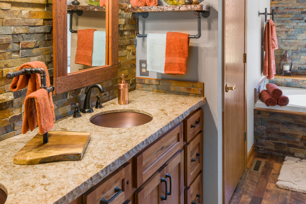 Example of a large mountain style master multicolored tile and porcelain tile dark wood floor, brown floor and double-sink bathroom design in Cleveland with shaker cabinets, medium tone wood cabinets, a two-piece toilet, beige walls, an undermount sink, quartz countertops, a hinged shower door, beige countertops, a niche and a built-in vanity