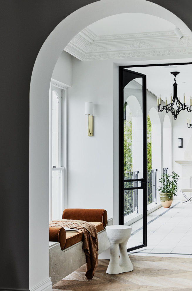 This is an example of a mid-sized transitional sunroom in Sydney with medium hardwood floors, no fireplace, a standard ceiling and brown floor.