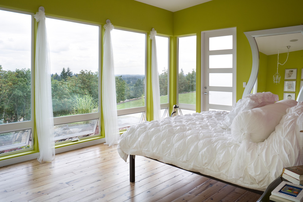 Photo of a contemporary bedroom in Portland with green walls.