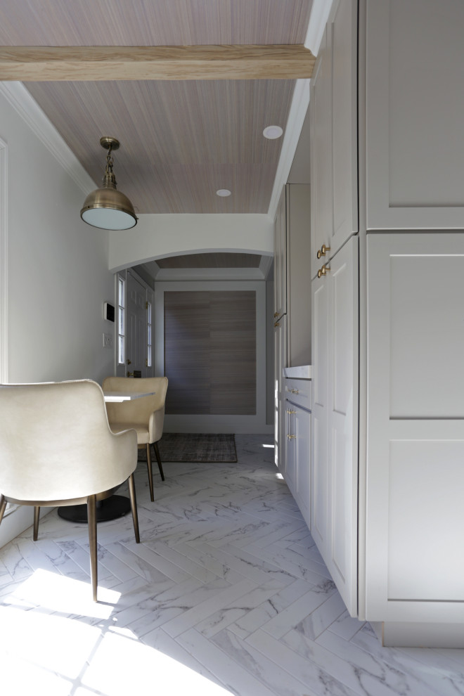Inspiration for a mid-sized transitional l-shaped marble floor, white floor and exposed beam kitchen remodel in DC Metro with an undermount sink, shaker cabinets, white cabinets, quartzite countertops, white backsplash, quartz backsplash and stainless steel appliances