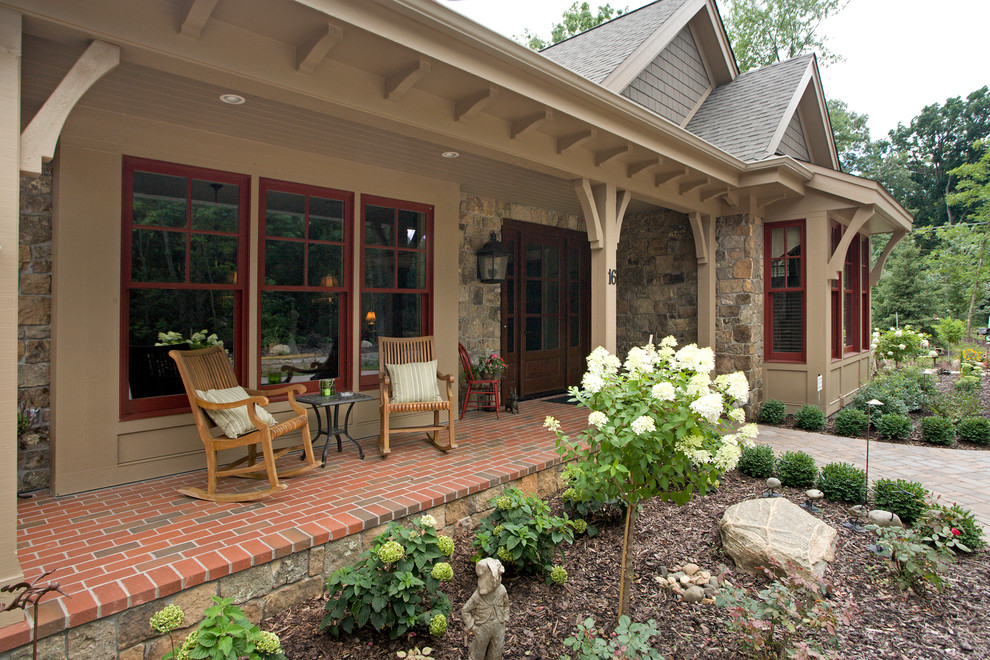 Inspiration for a large traditional front yard verandah in Minneapolis.
