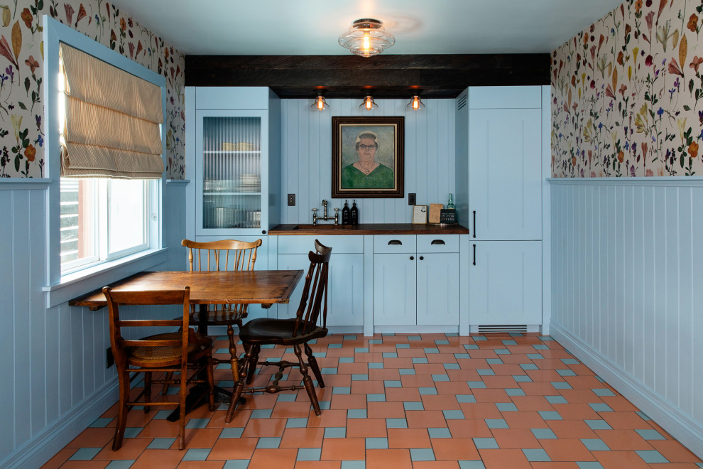 This is an example of a mid-sized modern single-wall kitchen in Los Angeles with ceramic floors and multi-coloured floor.