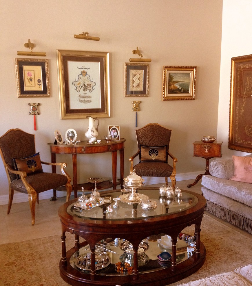 Photo of a mid-sized traditional formal enclosed living room in Phoenix with beige walls, porcelain floors, no fireplace and no tv.