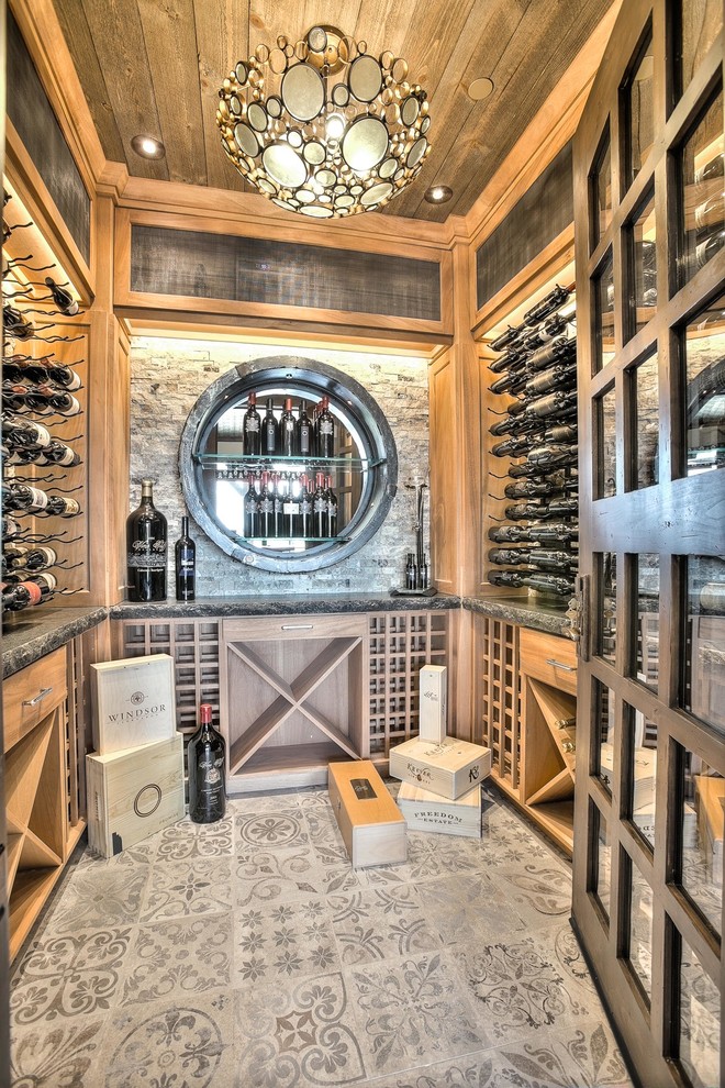 Expansive country wine cellar in Denver with slate floors and storage racks.