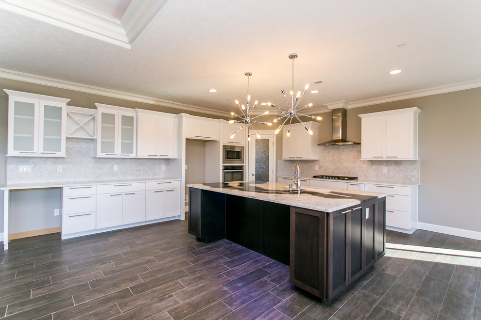 Inspiration for a mid-sized transitional l-shaped dark wood floor open concept kitchen remodel in Seattle with an undermount sink, shaker cabinets, white cabinets, granite countertops, gray backsplash, porcelain backsplash, stainless steel appliances and an island