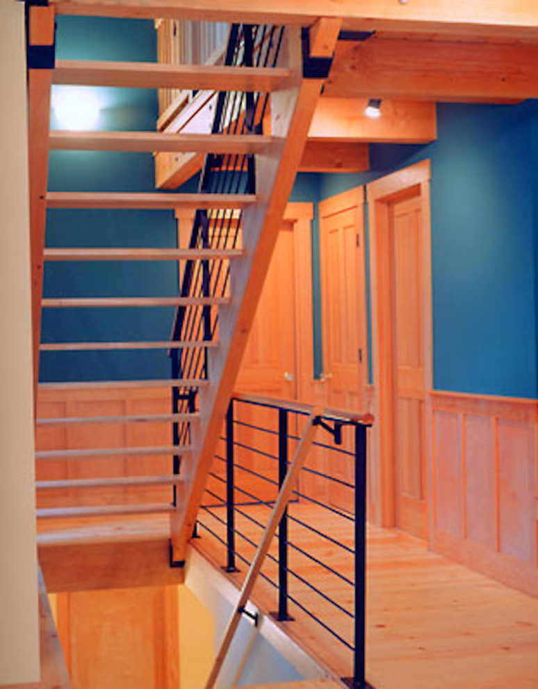 Example of a mountain style wooden l-shaped open staircase design in Seattle