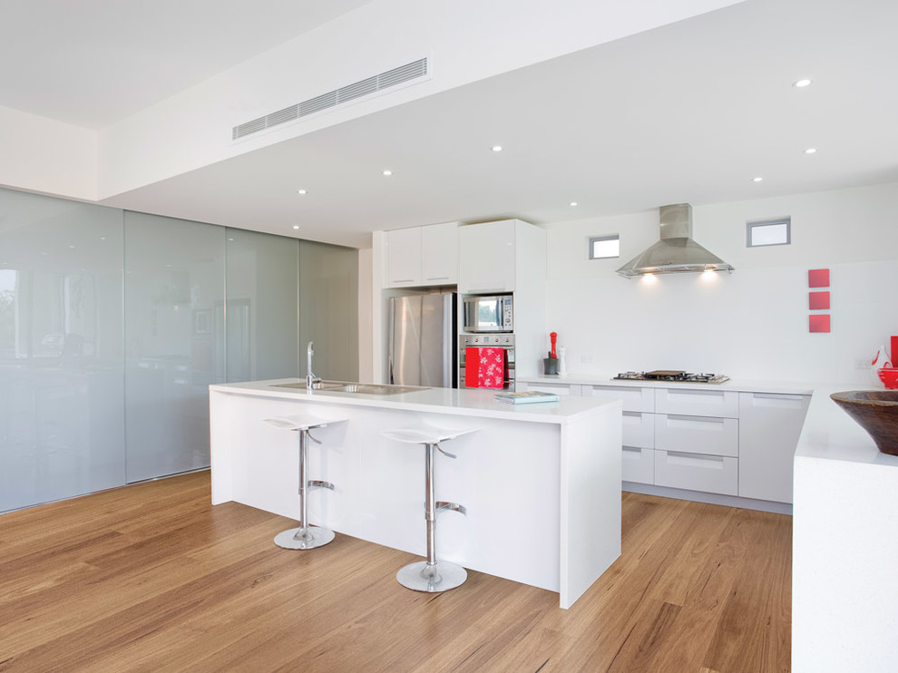 Design ideas for a contemporary kitchen in Melbourne with medium hardwood floors.