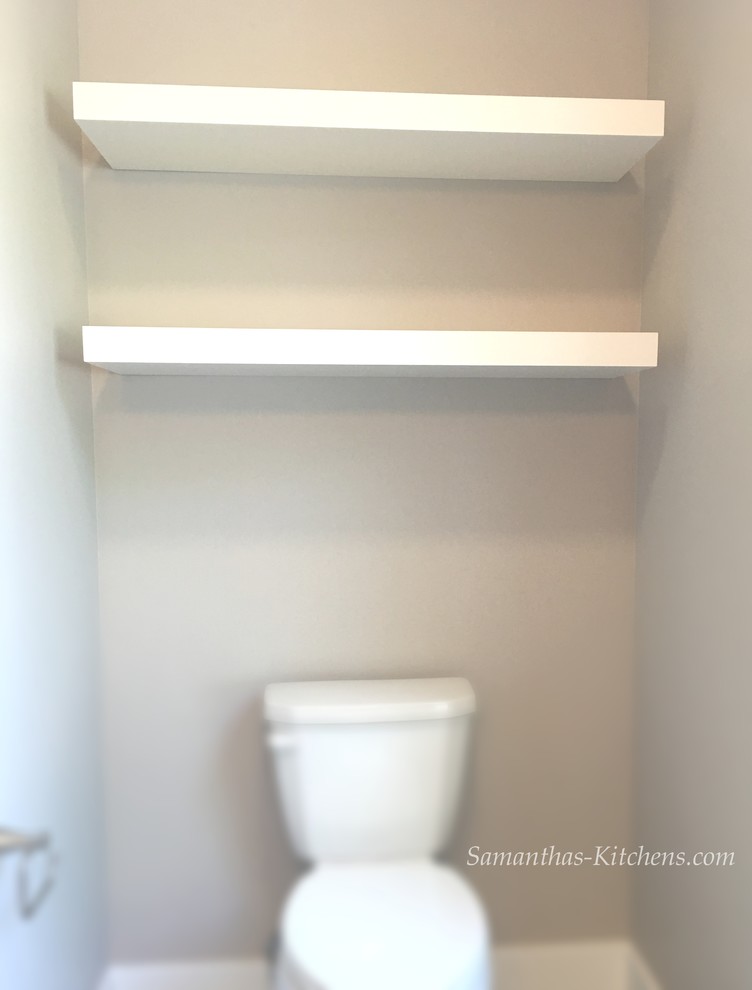 Inspiration for a mid-sized transitional home design remodel with white cabinets, a two-piece toilet and beige walls