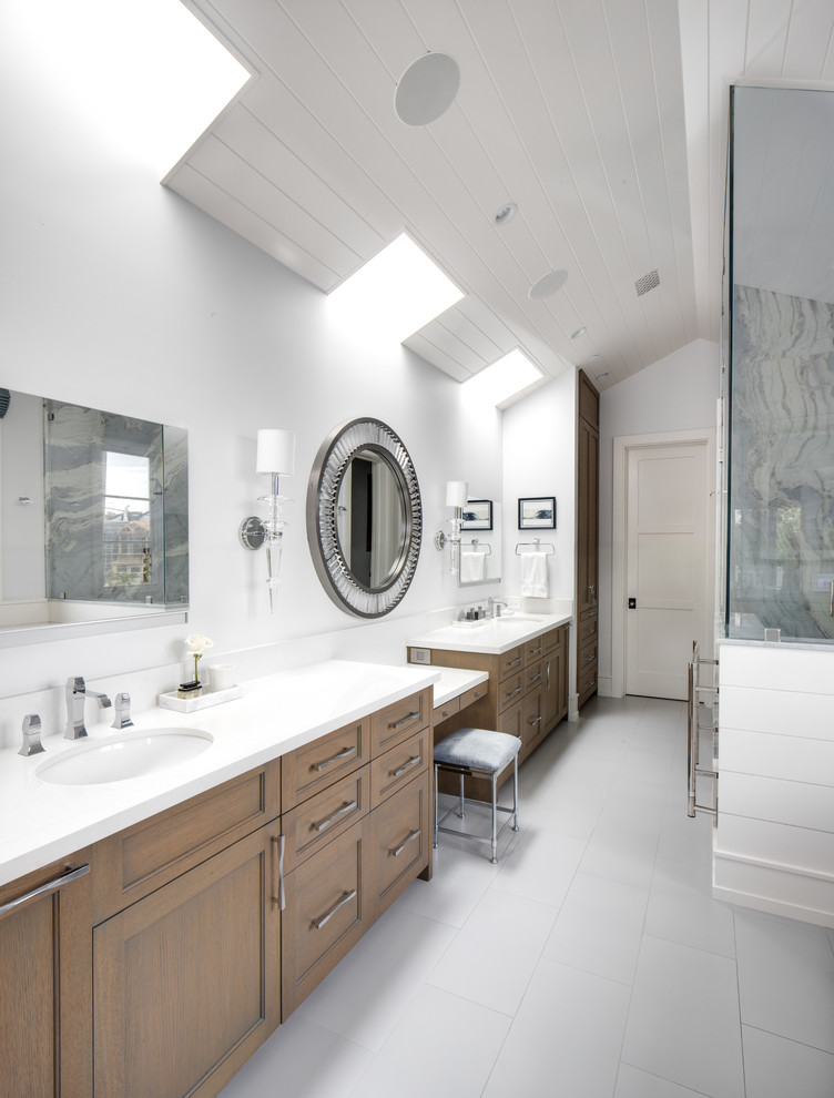 Design ideas for a beach style master bathroom in Los Angeles with shaker cabinets, medium wood cabinets, white walls, an undermount sink, white benchtops and grey floor.