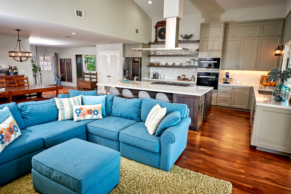 Large transitional l-shaped medium tone wood floor and brown floor open concept kitchen photo in Denver with an undermount sink, recessed-panel cabinets, gray cabinets, quartz countertops, white backsplash, marble backsplash, stainless steel appliances, an island and white countertops