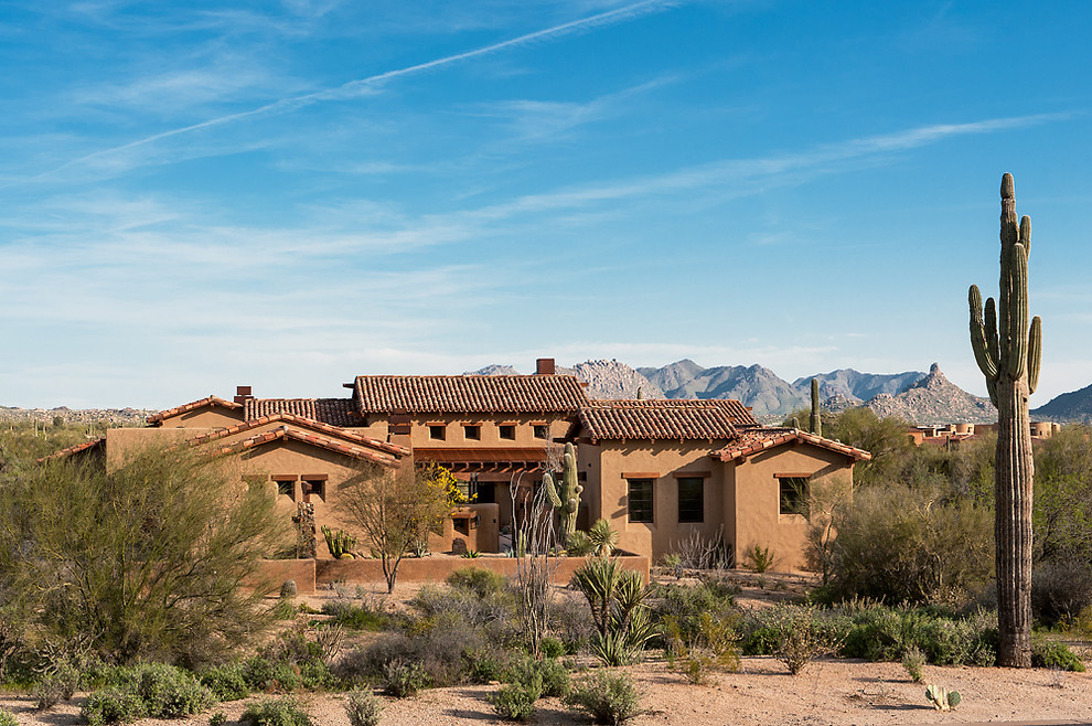This is an example of an exterior in Phoenix with a tile roof.