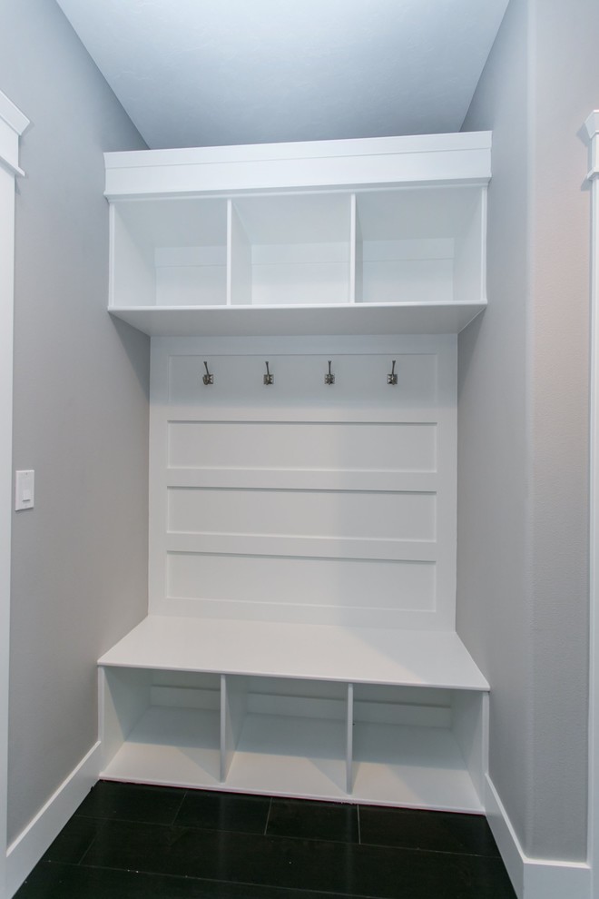 Inspiration for a small transitional dark wood floor mudroom remodel in Seattle with gray walls