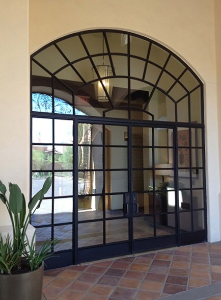 Inspiration for a large transitional terra-cotta tile front door remodel in Phoenix with white walls and a glass front door