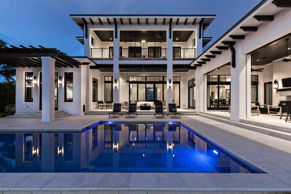 Large transitional two-storey white exterior in Miami.