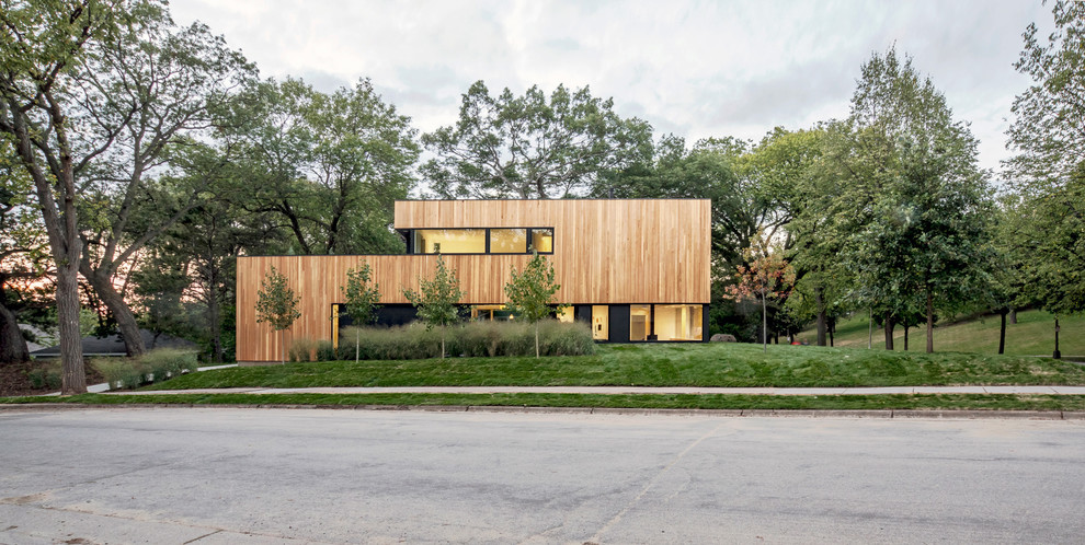 Photo of a modern two-storey brown house exterior in Minneapolis with wood siding and a flat roof.