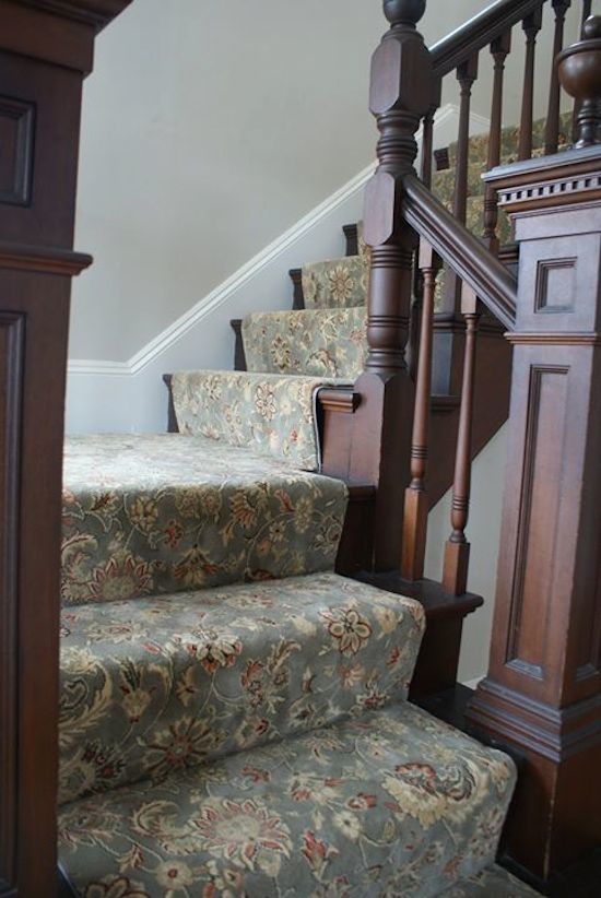 Mid-sized wood l-shaped staircase in Boston with carpet risers.