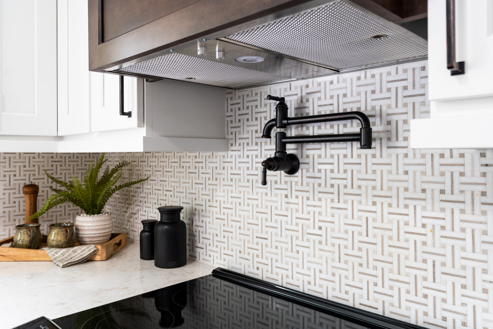 Example of a small transitional galley enclosed kitchen design in Seattle with shaker cabinets and no island
