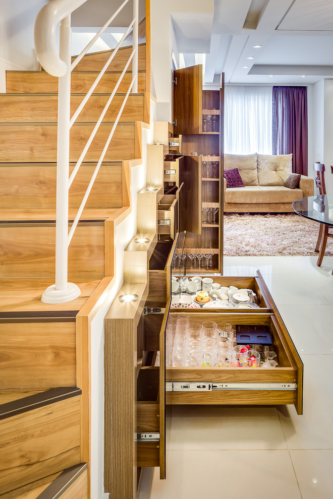 This is an example of a mid-sized contemporary wood u-shaped staircase in Other with wood risers.