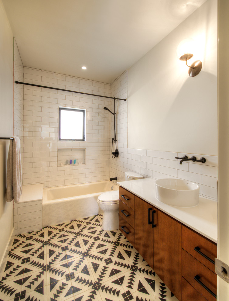 Mid-sized contemporary bathroom in San Diego with flat-panel cabinets, medium wood cabinets, an open shower, a one-piece toilet, blue tile, cement tile, white walls, mosaic tile floors, a drop-in sink, wood benchtops, grey floor and an open shower.