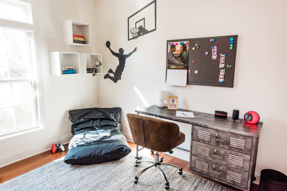 Mid-sized contemporary kids' room in New York with white walls, medium hardwood floors and brown floor for boys.