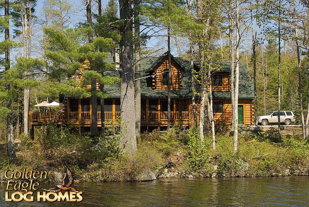 Example of a large mountain style home design design