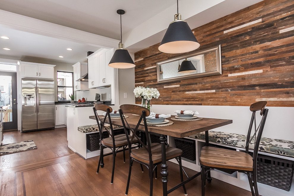 Photo of a mid-sized industrial open plan dining in Baltimore with beige walls, medium hardwood floors, no fireplace and brown floor.