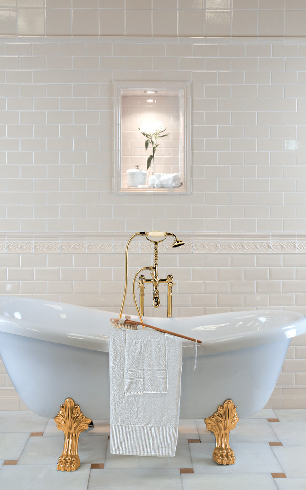 Inspiration for a mid-sized traditional master bathroom in Portland with a claw-foot tub, marble floors, beige tile and porcelain tile.