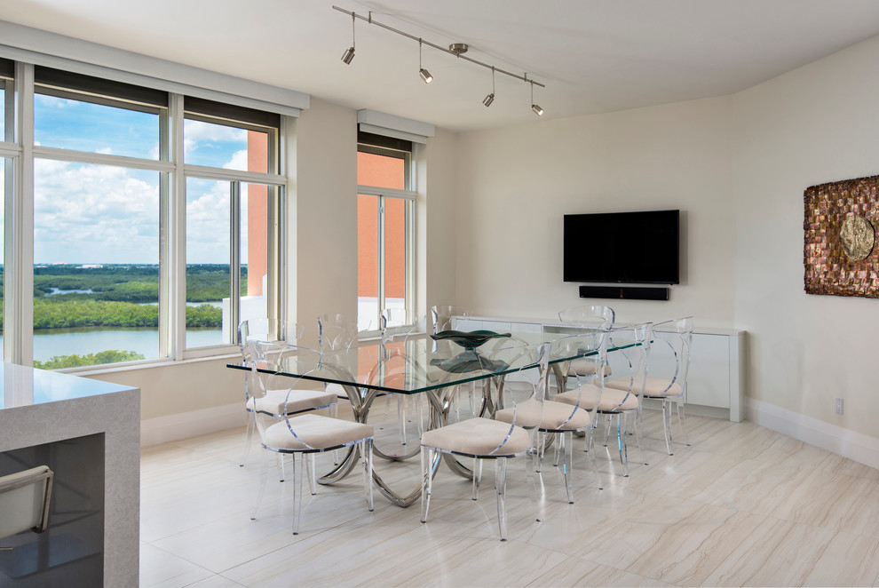 This is an example of a large contemporary kitchen/dining combo in Miami with white walls.