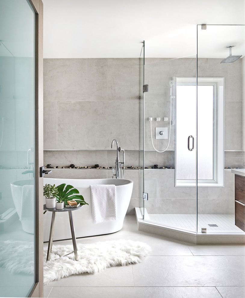 Example of a large trendy master gray tile and porcelain tile porcelain tile and gray floor bathroom design in Toronto with flat-panel cabinets, medium tone wood cabinets, a vessel sink, quartz countertops, a hinged shower door and gray walls
