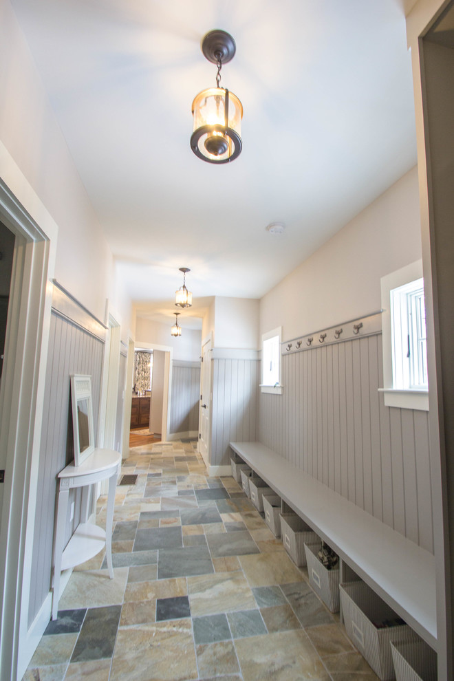 Traditional hallway in Boston with grey walls and slate floors.