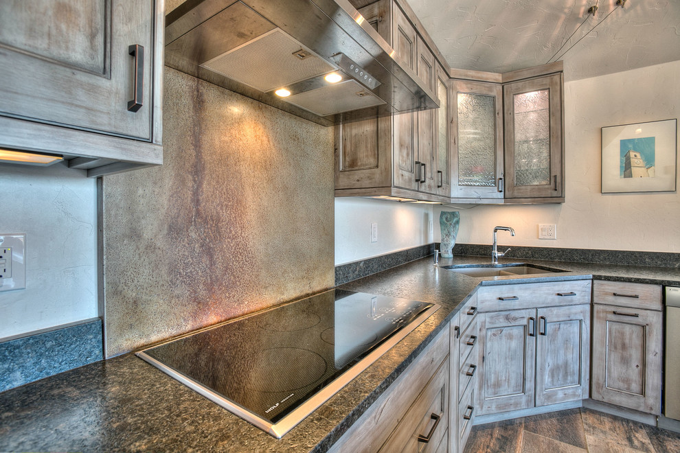 Example of a mountain style l-shaped ceramic tile eat-in kitchen design in Denver with a double-bowl sink, beaded inset cabinets, gray cabinets, granite countertops, gray backsplash, stainless steel appliances and an island