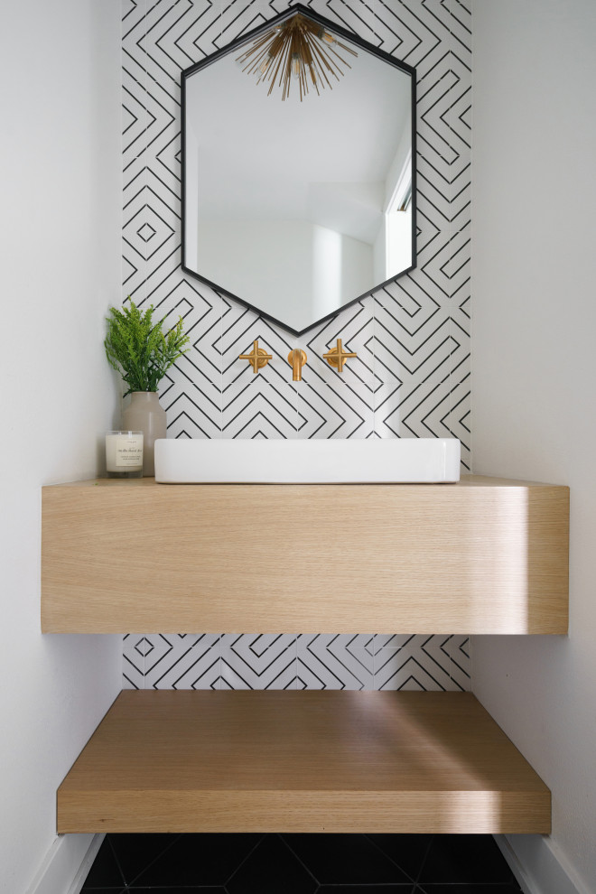 Photo of a beach style powder room in Orange County with beige benchtops.
