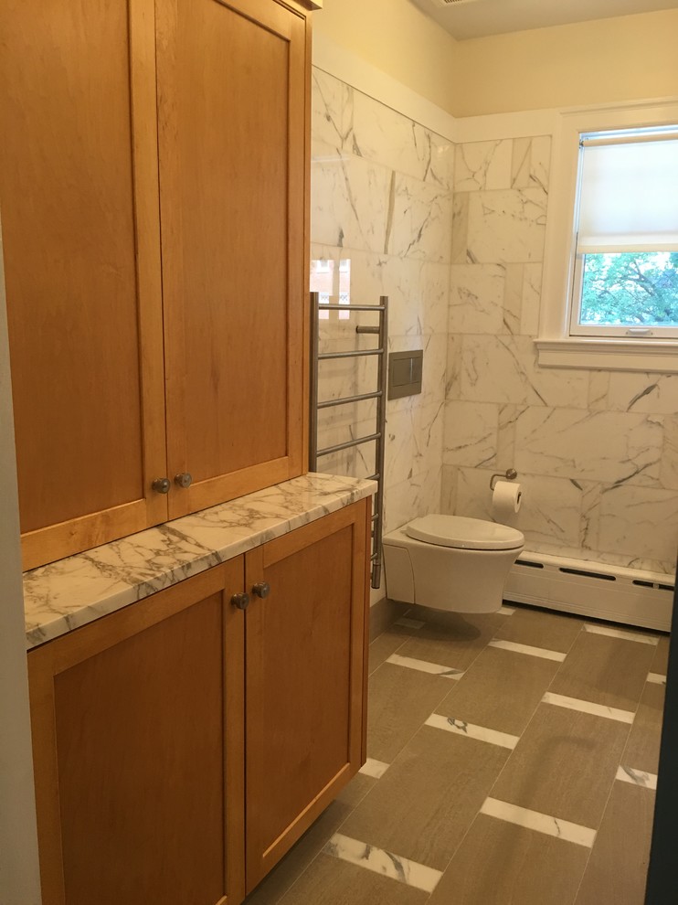 Inspiration for a mid-sized transitional master bathroom in Boston with beaded inset cabinets, medium wood cabinets and marble benchtops.