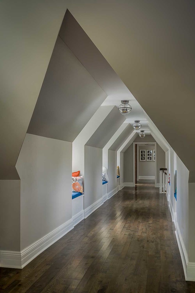 Large country hallway in Chicago with grey walls and dark hardwood floors.