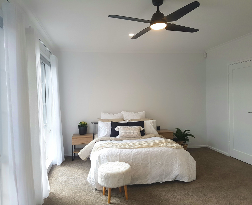 Scandinavian bedroom in Canberra - Queanbeyan with white walls and carpet.