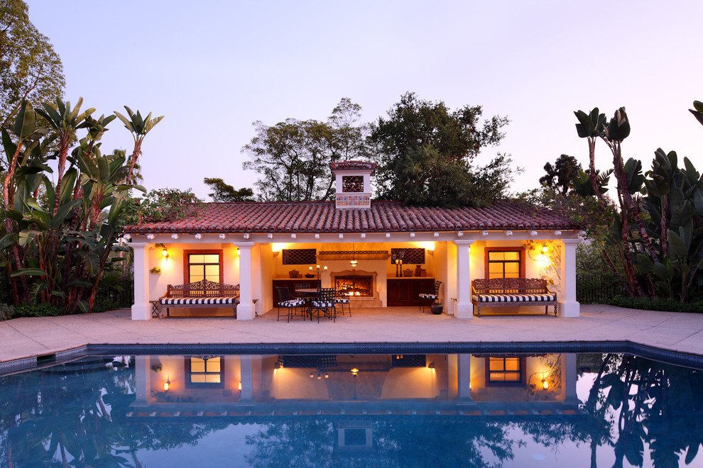 Photo of a mediterranean pool in Los Angeles with a pool house.