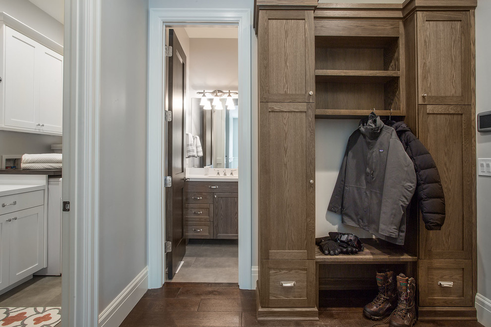 Inspiration for a mid-sized country mudroom in Salt Lake City with grey walls, dark hardwood floors and brown floor.