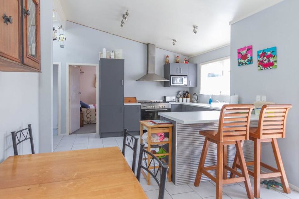 Inspiration for a small modern u-shaped eat-in kitchen in Hamilton with a single-bowl sink, grey cabinets, laminate benchtops, stainless steel appliances, ceramic floors and with island.