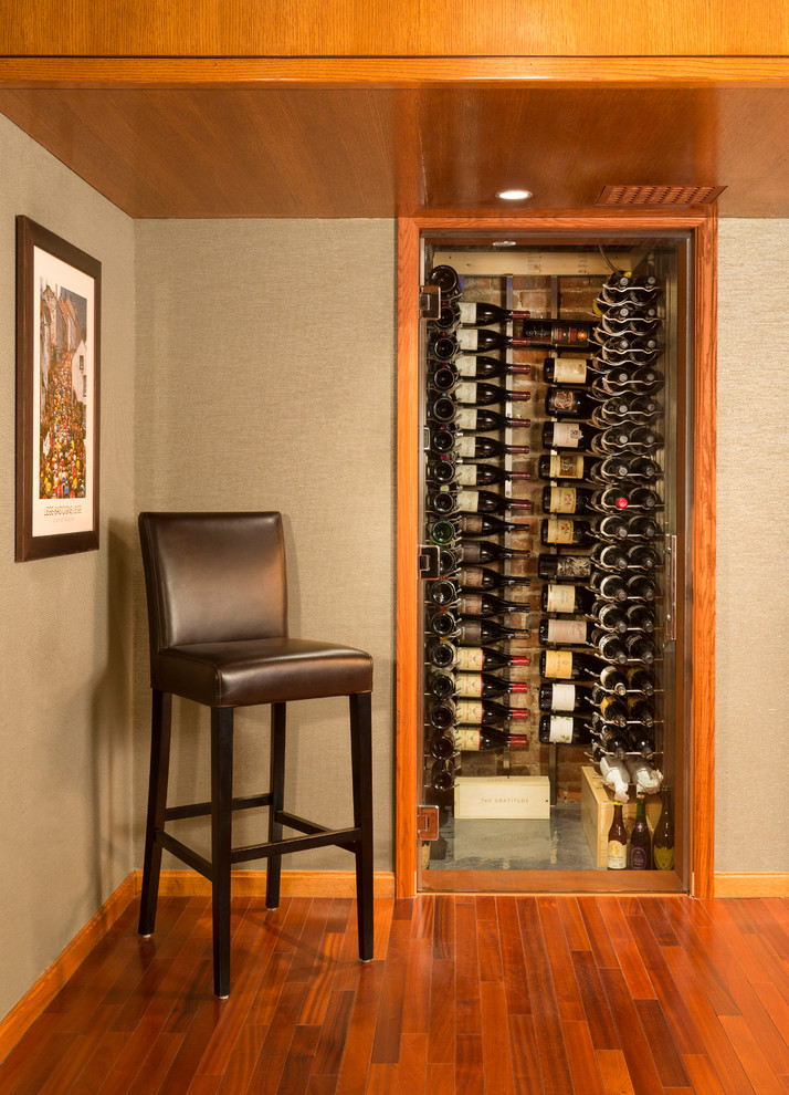 Small traditional wine cellar in Denver with storage racks.