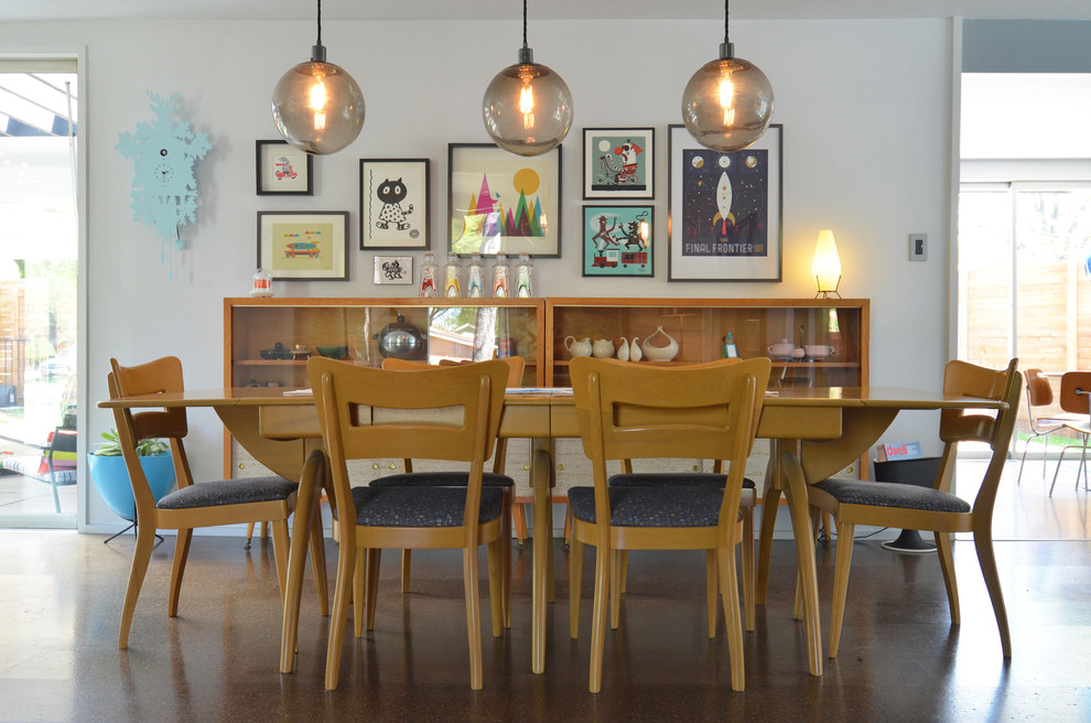 Midcentury dining room in Dallas with white walls.