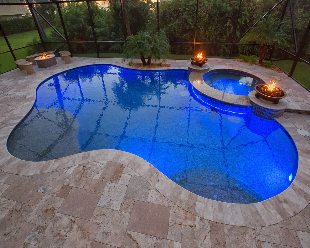 Photo of a small modern indoor custom-shaped pool in Phoenix with a hot tub and tile.