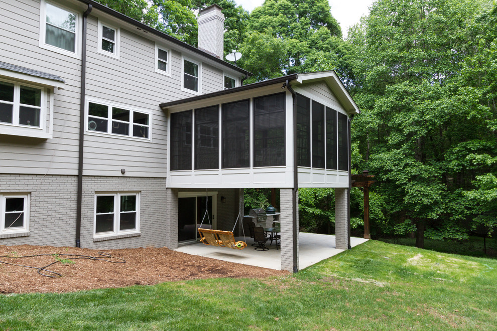 Photo of a transitional backyard screened-in verandah in Charlotte with a pergola and concrete slab.