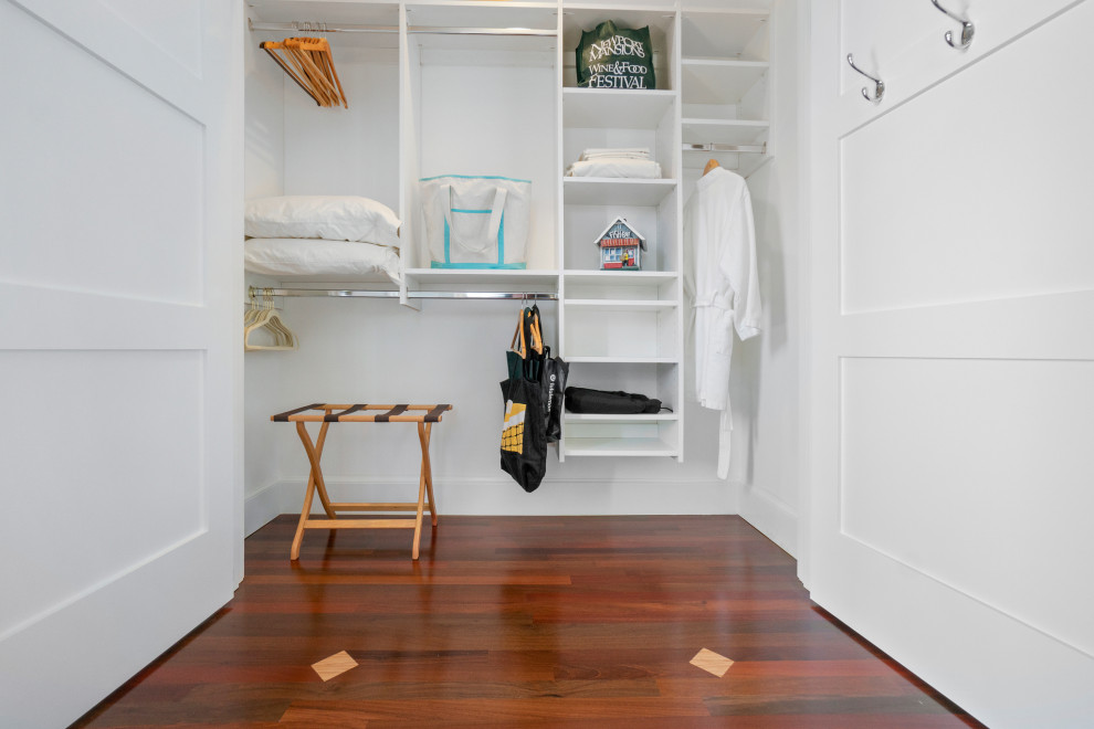 This is an example of a mid-sized beach style storage and wardrobe in Providence with medium hardwood floors and brown floor.
