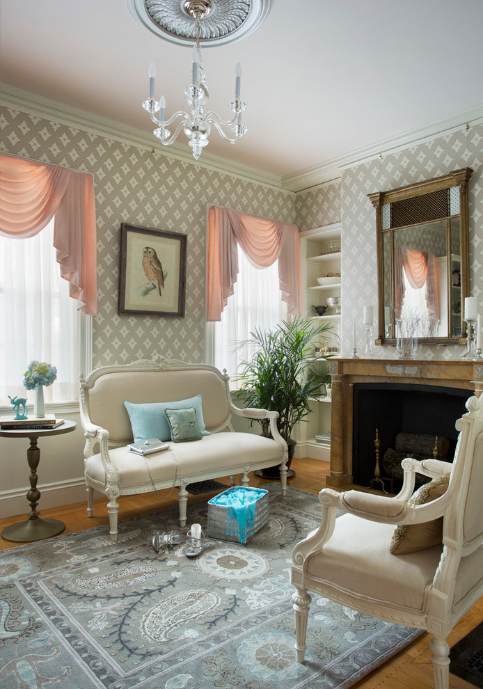 Inspiration for a small timeless enclosed light wood floor living room library remodel in Boston with gray walls, a standard fireplace and a stone fireplace