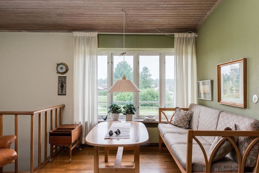 Mid-century modern family room photo in Stockholm