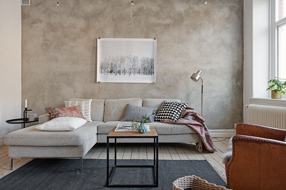 Esempio di un soggiorno chic di medie dimensioni e aperto con pareti grigie, parquet chiaro, nessun camino e nessuna TV