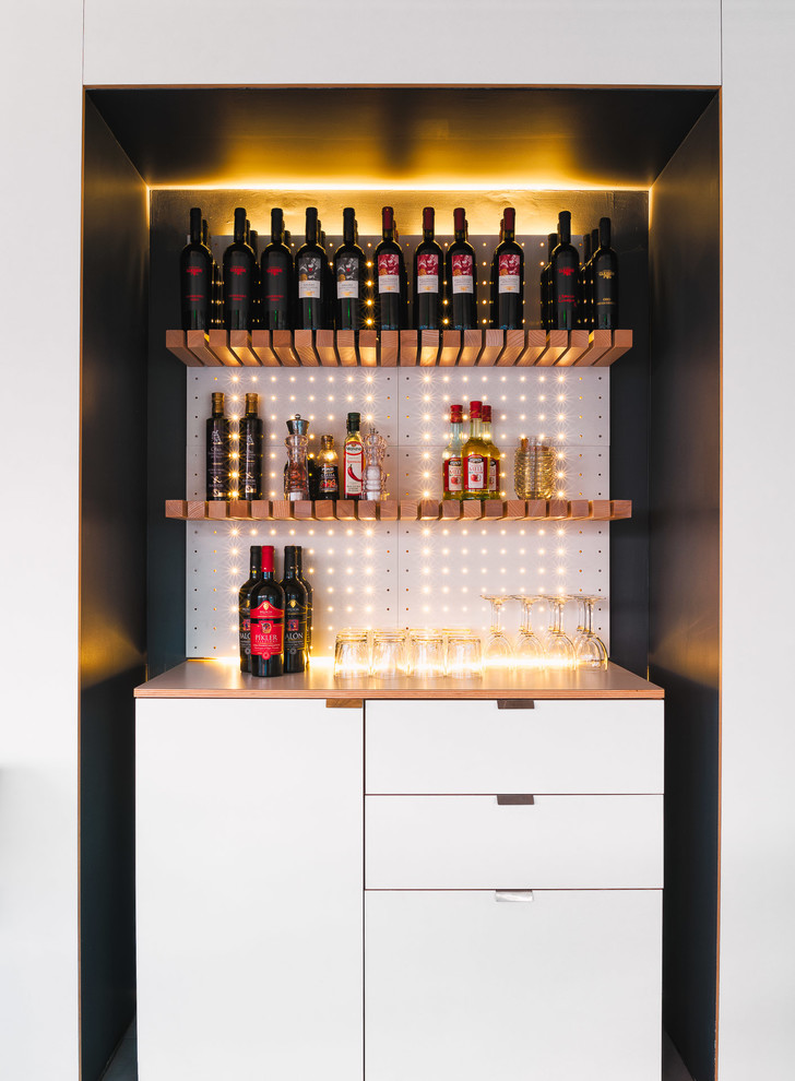 Small contemporary home bar in Other with flat-panel cabinets, white cabinets and brown worktops.