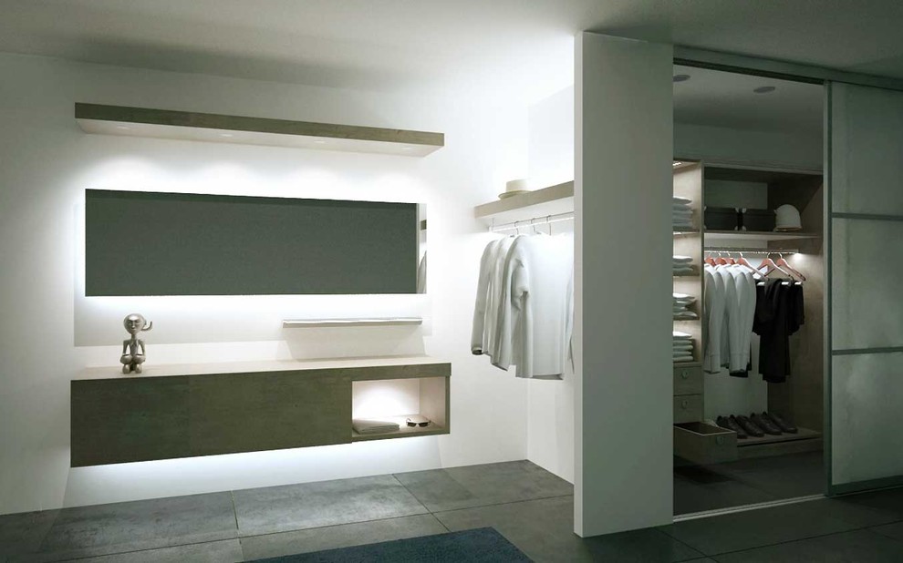 Réalisation d'un grand dressing room design neutre avec un placard sans porte, sol en béton ciré et un sol gris.