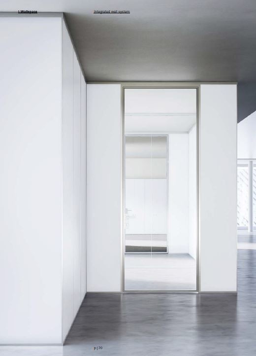 Esempio di un ampio atelier moderno con pareti bianche, scrivania autoportante, pavimento in cemento e pavimento grigio